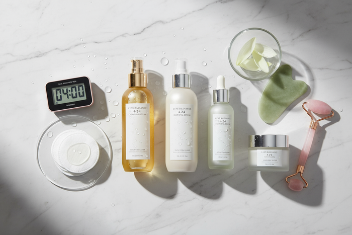 Close-up view of a person gently massaging a cleansing oil onto their face, demonstrating the slow, circular motions used in the 4-2-4 cleansing ritual for deep purification and anti-aging support।